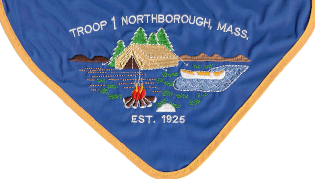 Troop 1 Northborough neckerchief — an embroidered lakeside scene with a tent, canoe, and campfire, reading &ldquo;Troop 1 Northborough, Mass.&rdquo; and &ldquo;Est. 1925&rdquo;